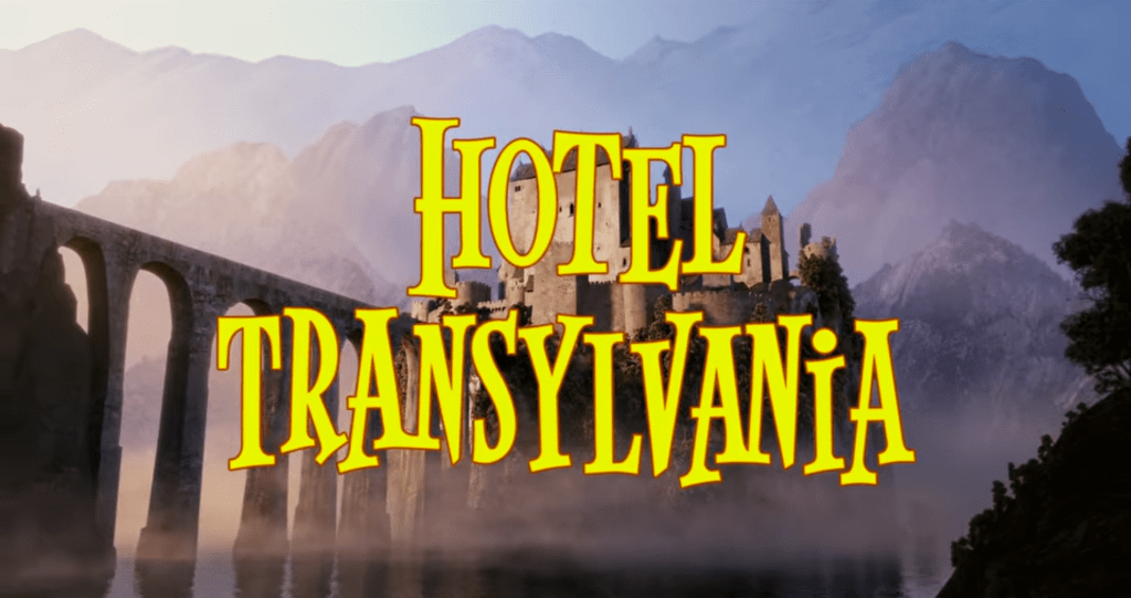 The title card of Hotel Transylvania, the title of the film superimposed over a scene of a castle among trees and mountains.