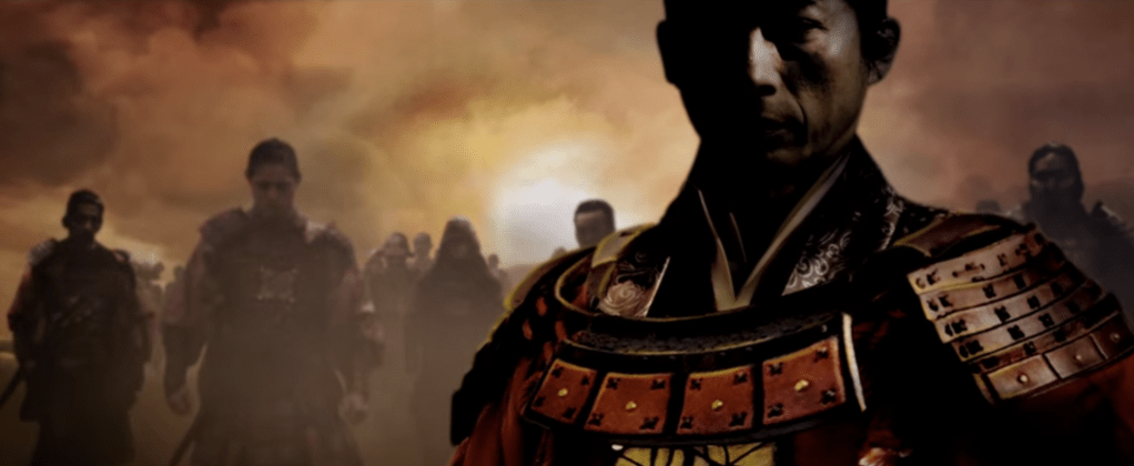 A scene from 47 Ronin, several samurai standing in front of a sunset.