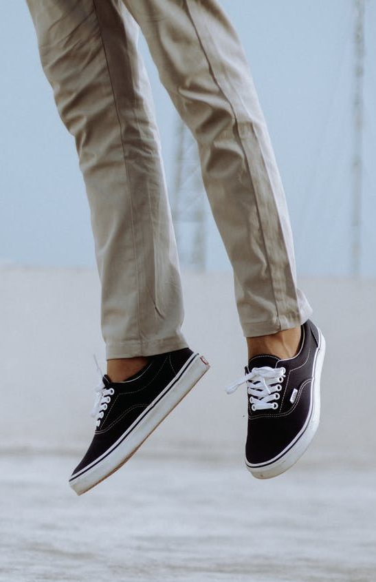 The legs of a person jumping.