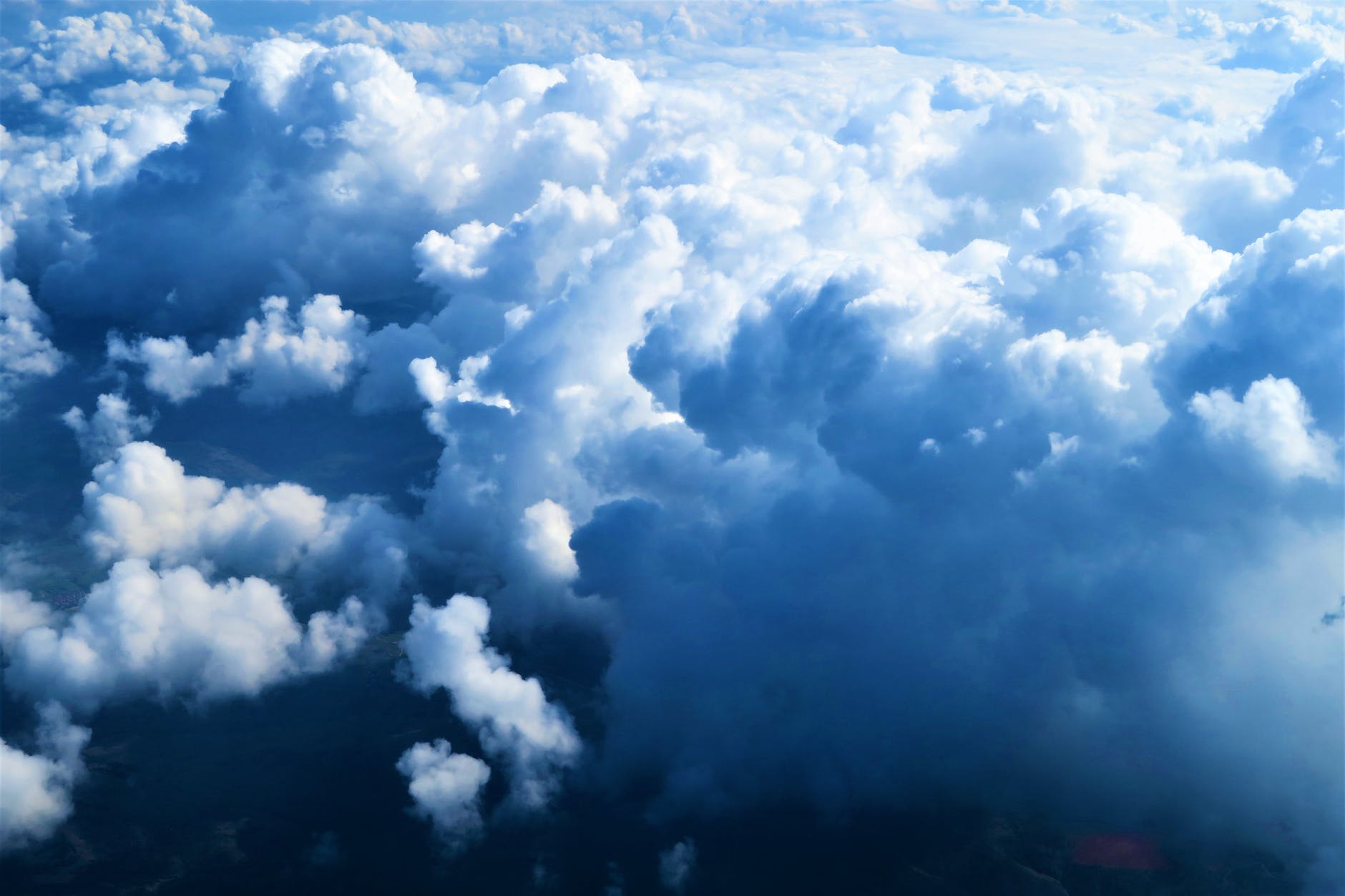 A sky full of clouds, seen from above the clouds.