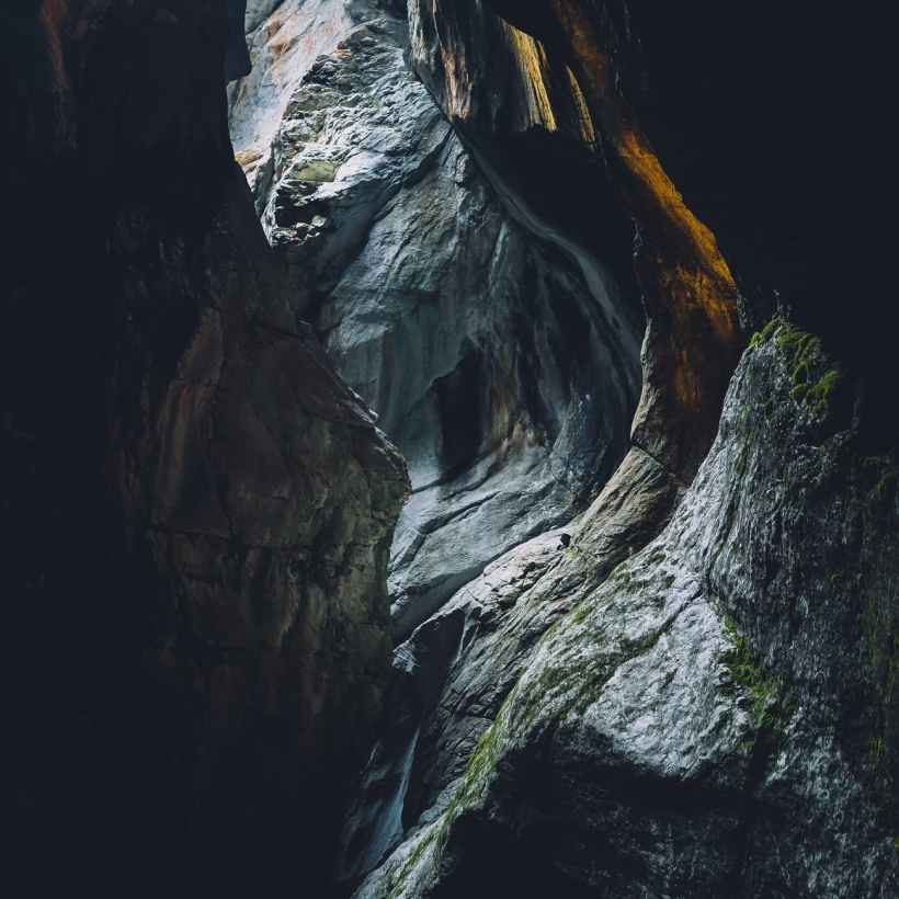 Sunlight streaming into a vertical cavern.