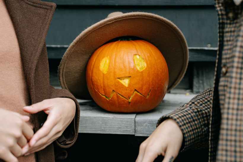 A jack-o-lantern wearing a hat.