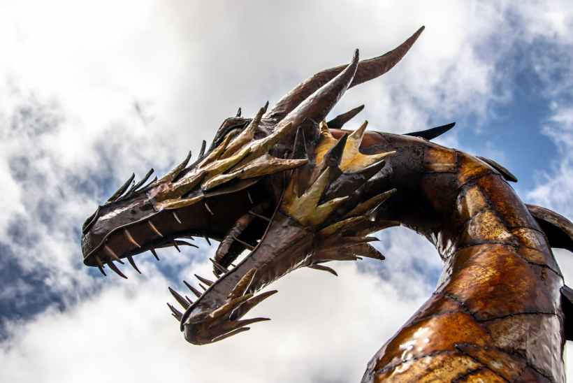 A dragon statue from a low angle.