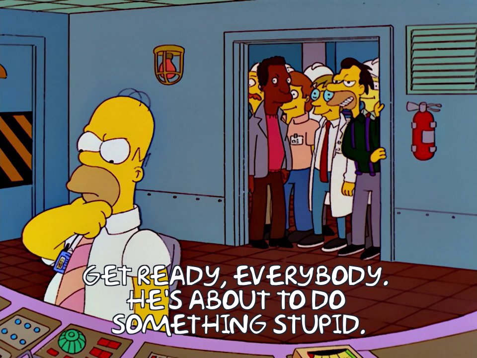 A screenshot from "The Simpsons." Homer about to do something stupid.