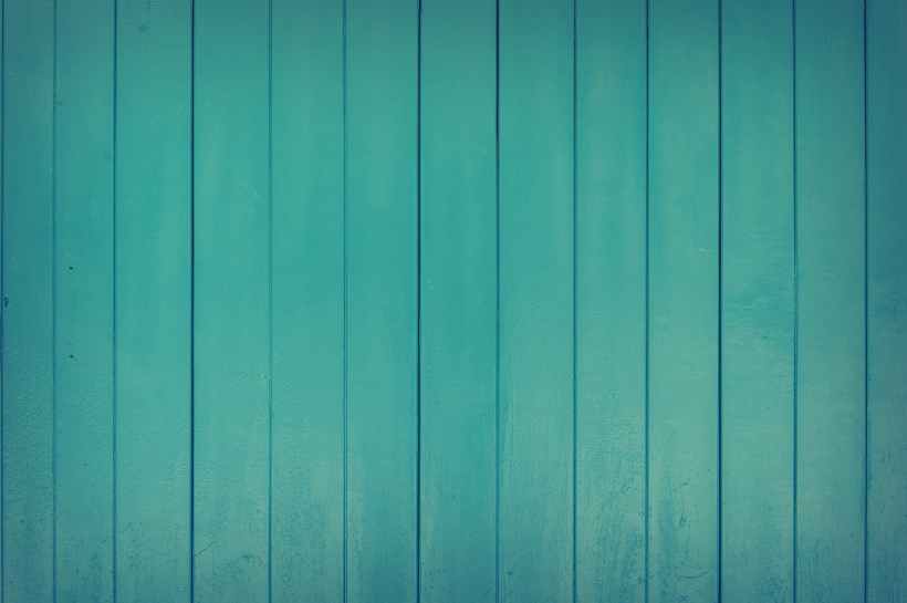 Blue-green wooden wall panelling.