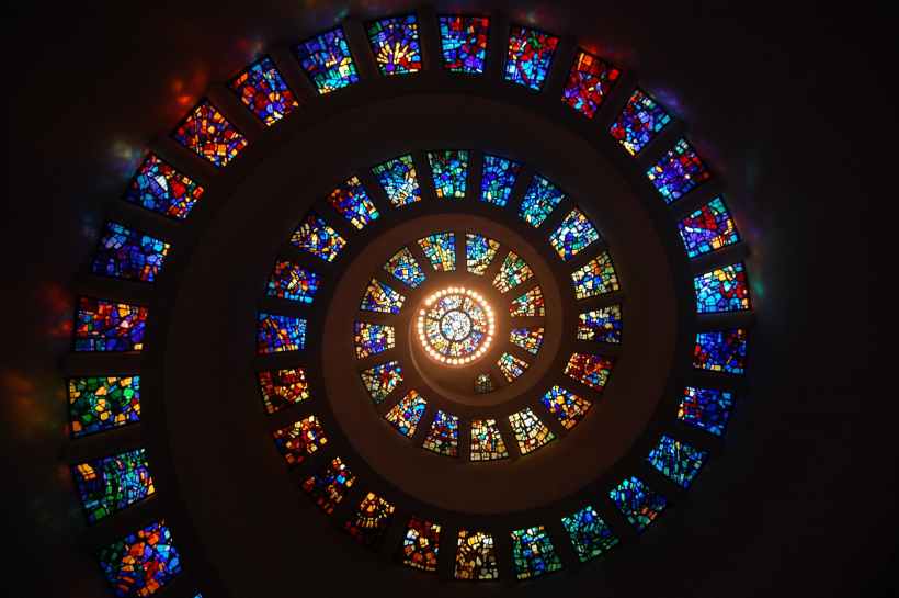 Stained glass images arranged in a spiral.