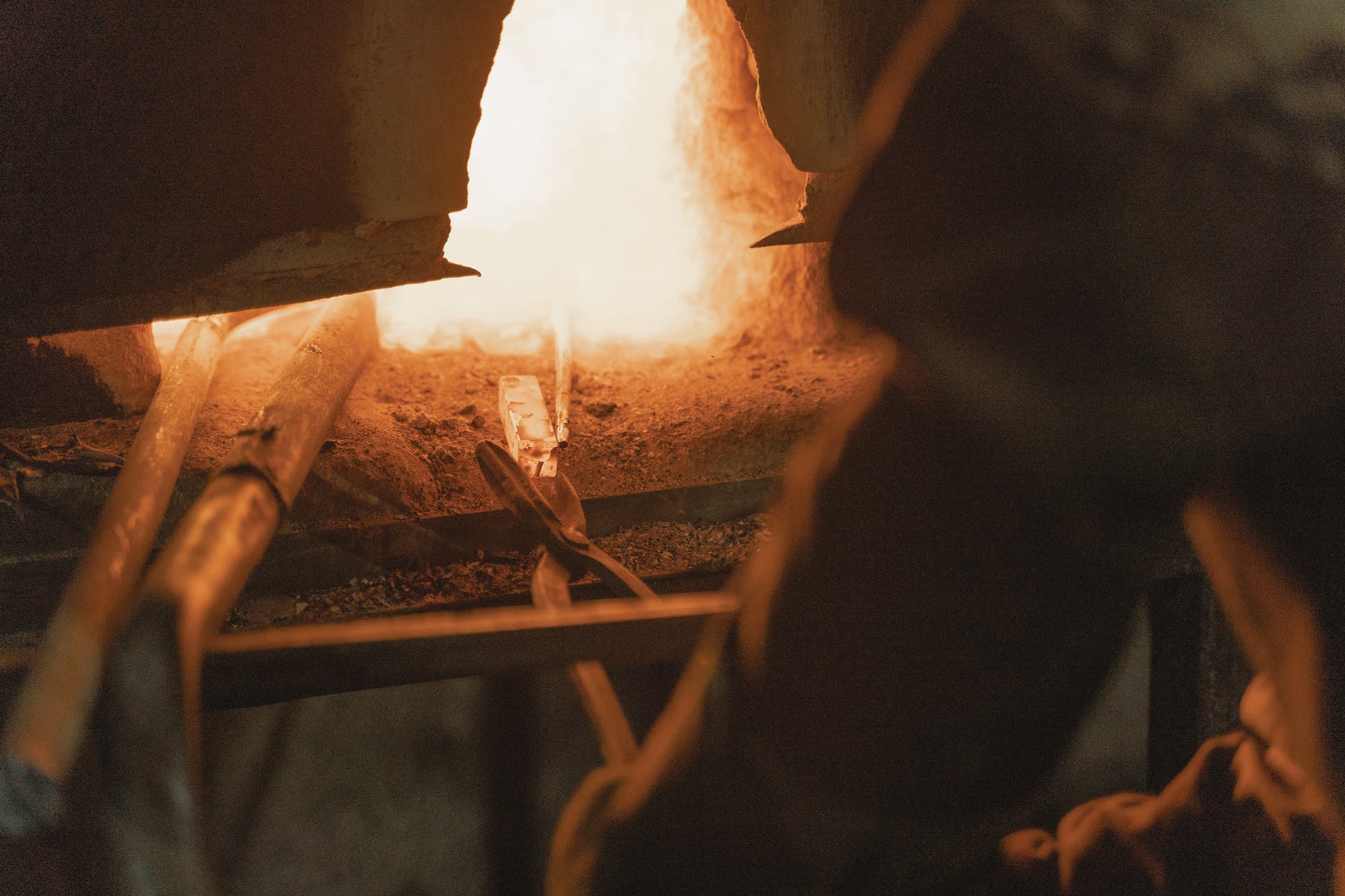 Metal being heated in a blacksmith's forge.