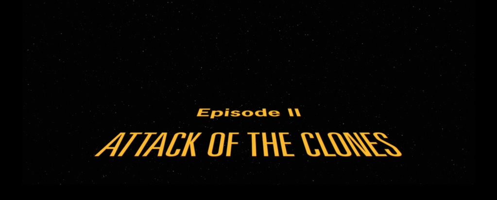 The title of "Attack of the Clones" as depicted in the opening of the movie.