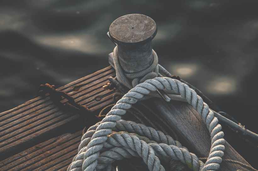 Ropes tied to the end of a dock.