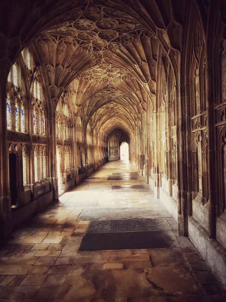 A vaulted corridor at Gloucester Cathedral.