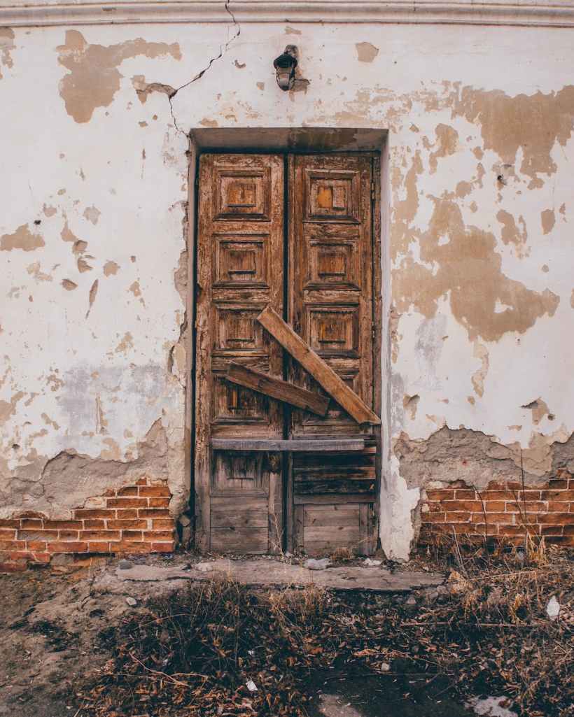 The door of a derelict building.