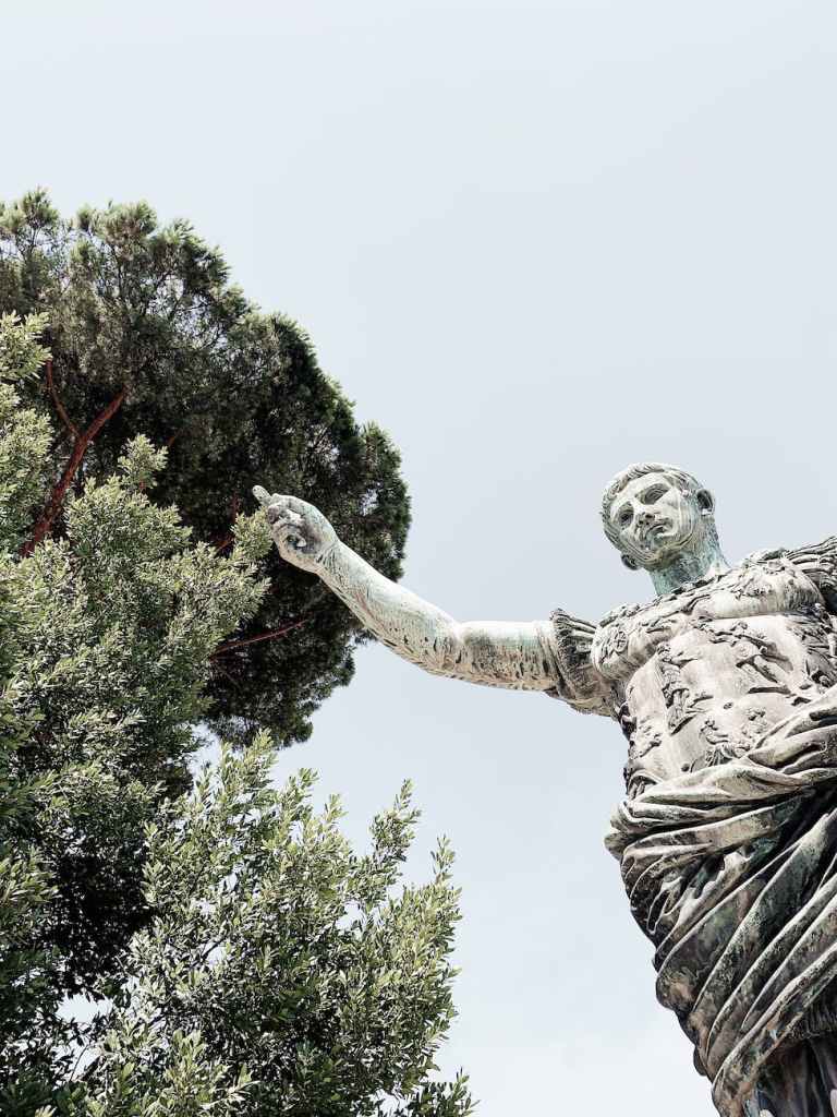 A copy of the Augustus of Prima Porta, seen from a low angle.