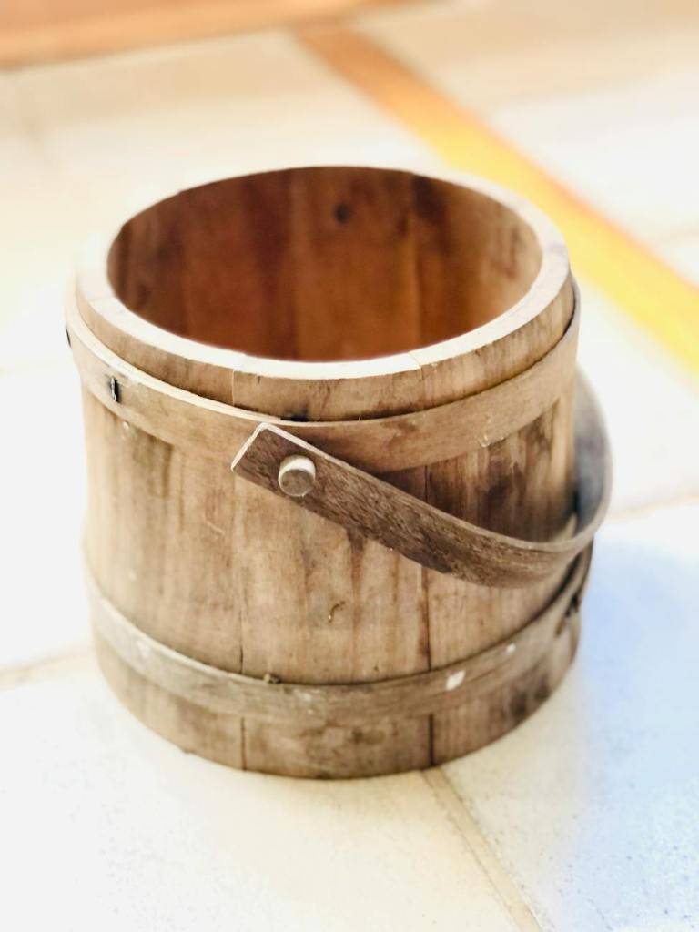 A wooden bucket.