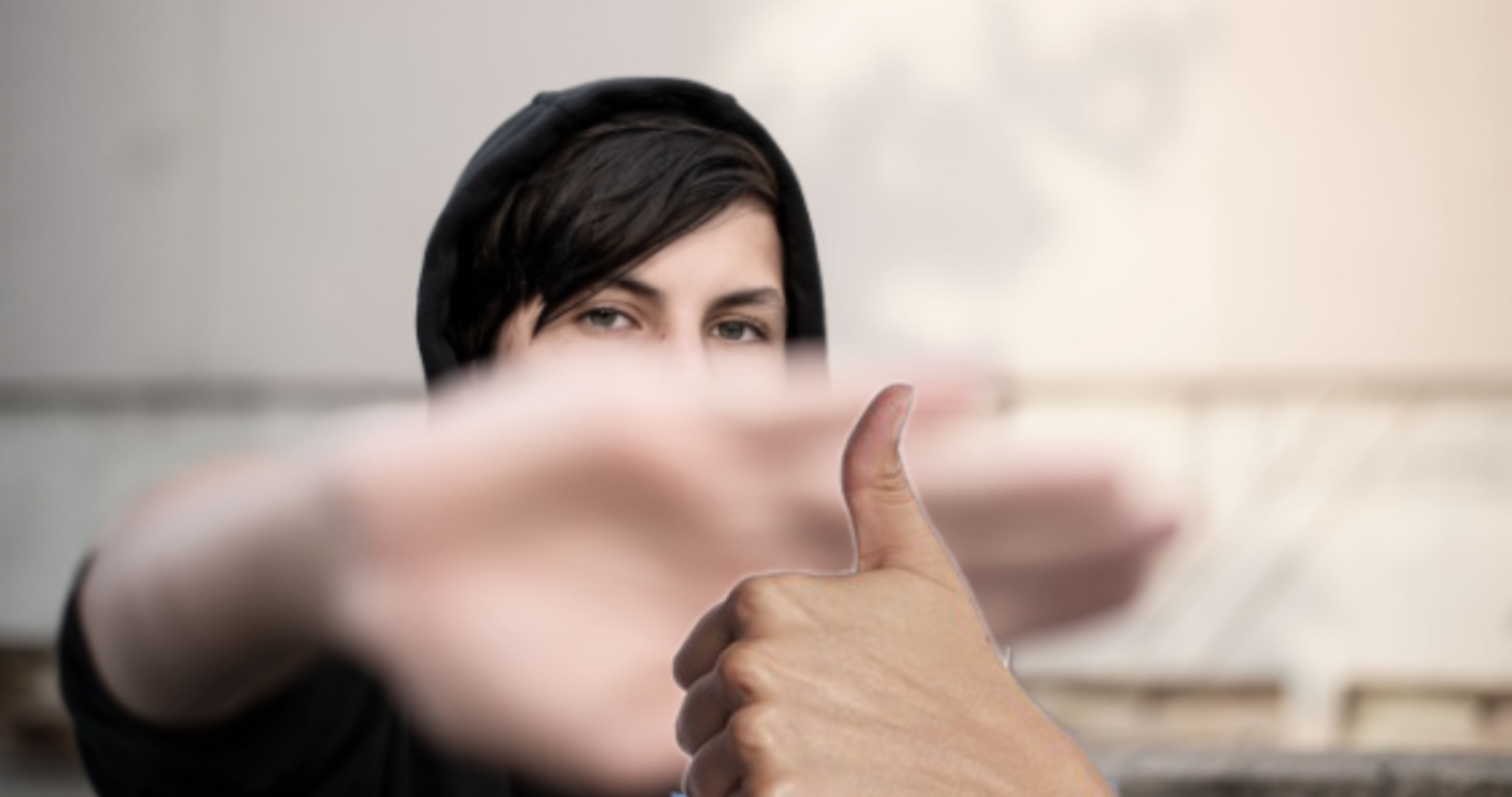 An edited image of a woman with a thumbs-up in front of her hand.