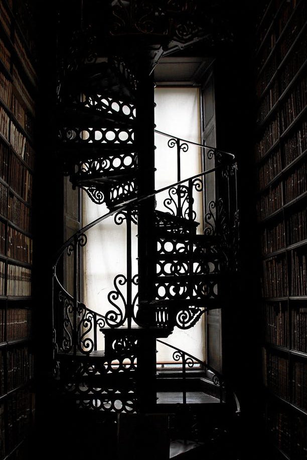 A spiral staircase in a library.