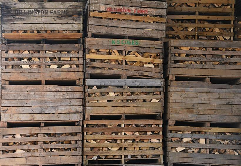 Wooden crates in a 3x3 pile.