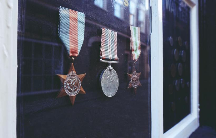 Three medals in a display case.