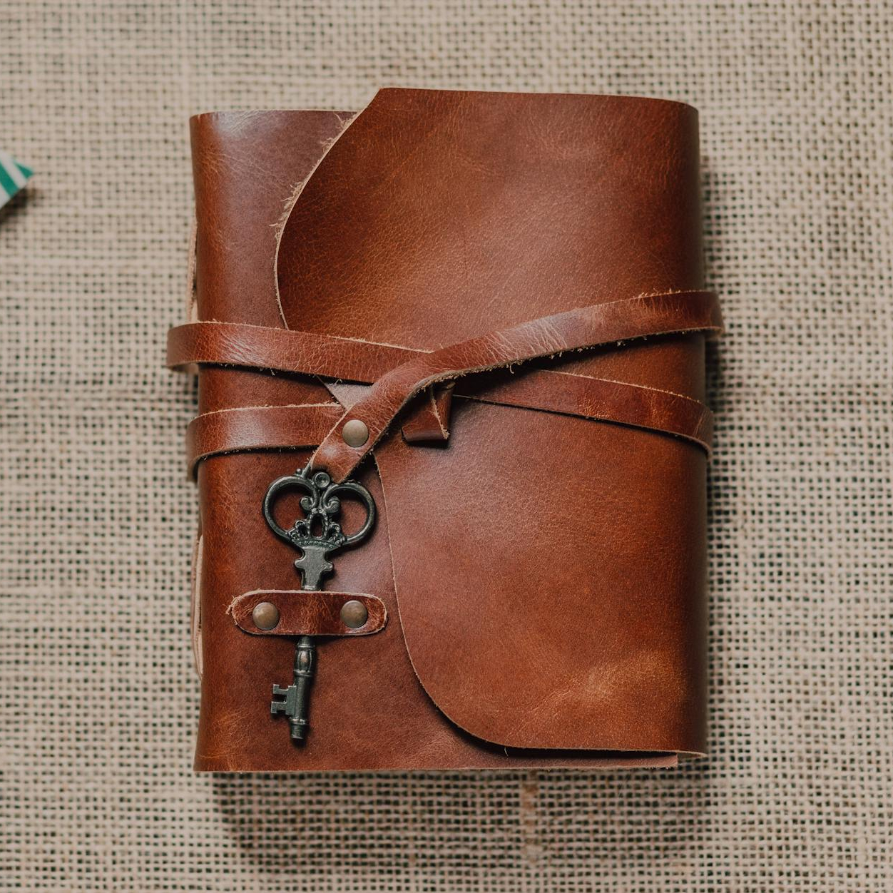 A leatherbound book with a key.