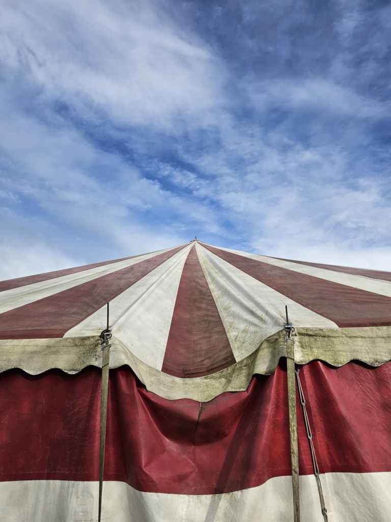 A striped carnival tent.