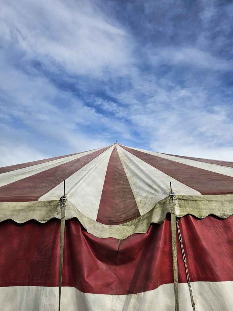 A striped carnival tent.