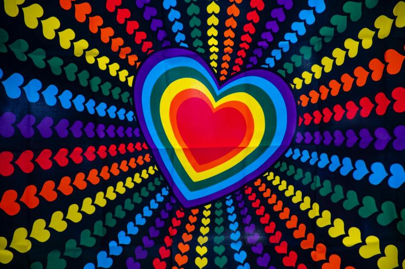 A heart on a multicoloured background of other hearts.