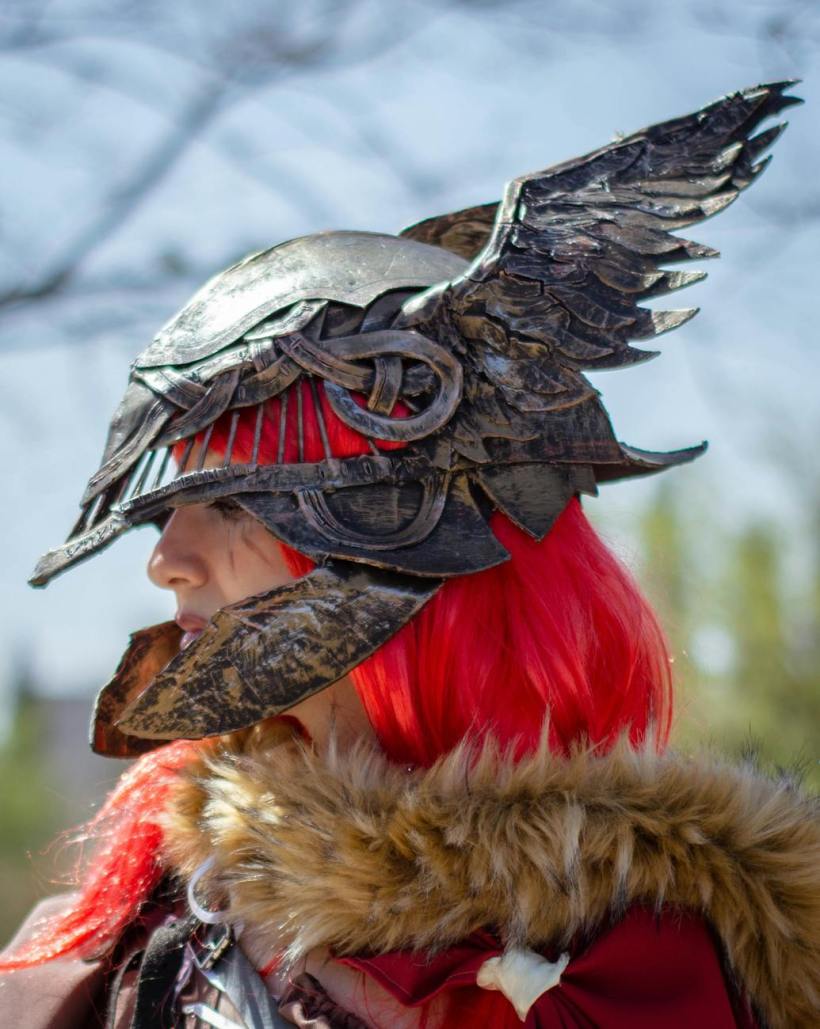 A woman with red hair and a winged helmet.