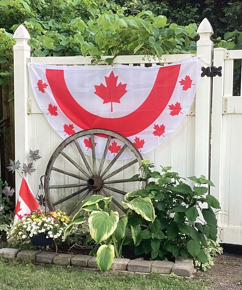 A Canada Day banner on my parents' garden fence.