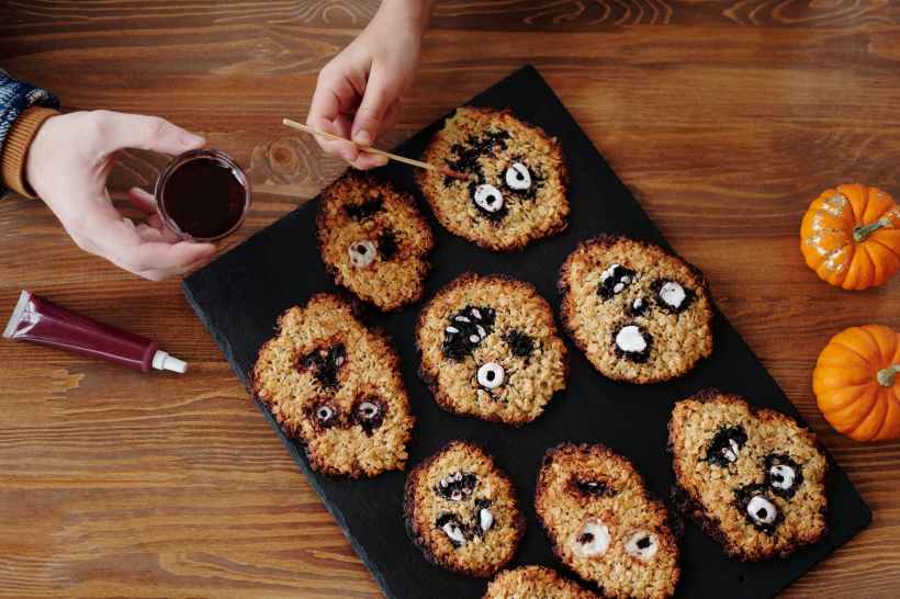 A tray of cookies decorated to look like monsters.