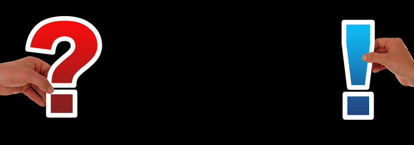 One hand holding a question mark and another holding an exclamation mark.