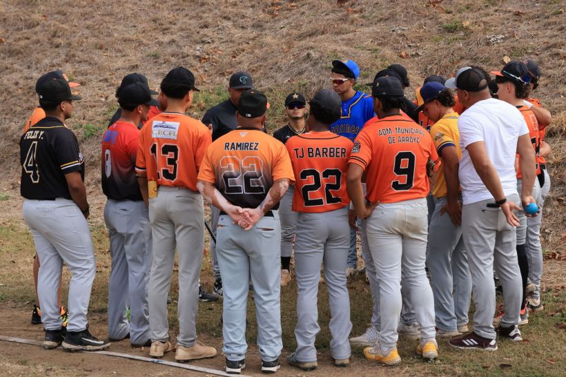A baseball team in a huddle.