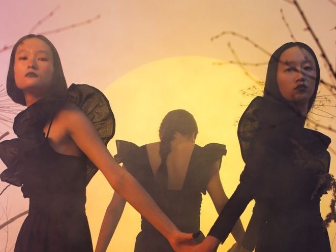 Three women dressed as witches