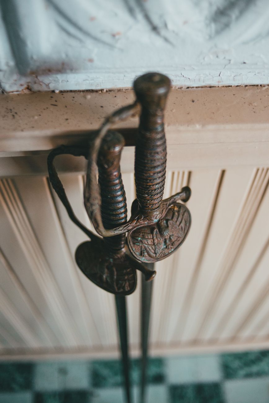 The hilts of two old swords.