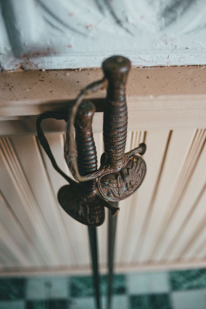 The hilts of two old swords.